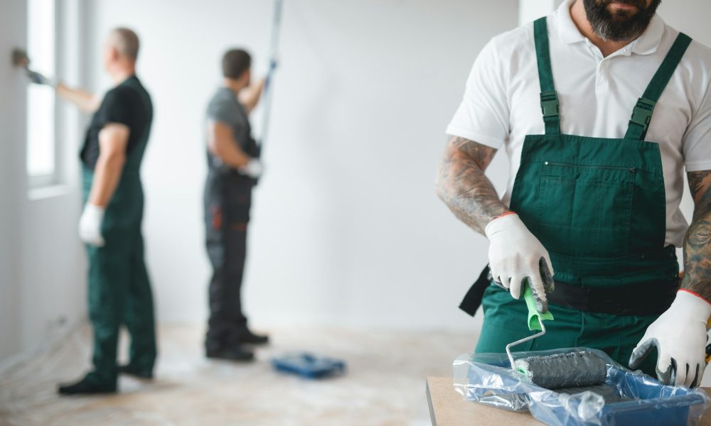 Builder preparing to paint the apartment during renovation